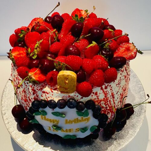 Vanilla Sponge Cake with alternative Raspberry Jam and Buttercream Layers, decorated with Fresh Seasonal Fruits