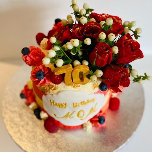 Chocolate Vanilla Sponge Cake decorated with Fresh Buttercream, Fruits and Flowers