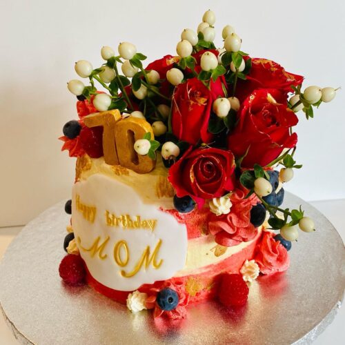 Chocolate Vanilla Sponge Cake decorated with Fresh Buttercream, Fruits and Flowers