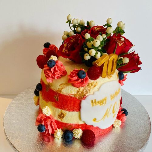 Chocolate Vanilla Sponge Cake decorated with Fresh Buttercream, Fruits and Flowers