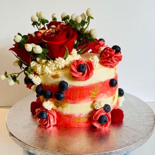 Chocolate Vanilla Sponge Cake decorated with Fresh Buttercream, Fruits and Flowers