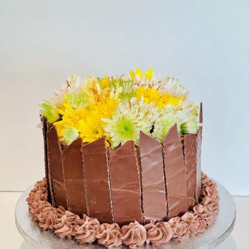 Chocolate Cake decorated with Chocolate Shards and Flowers Topper